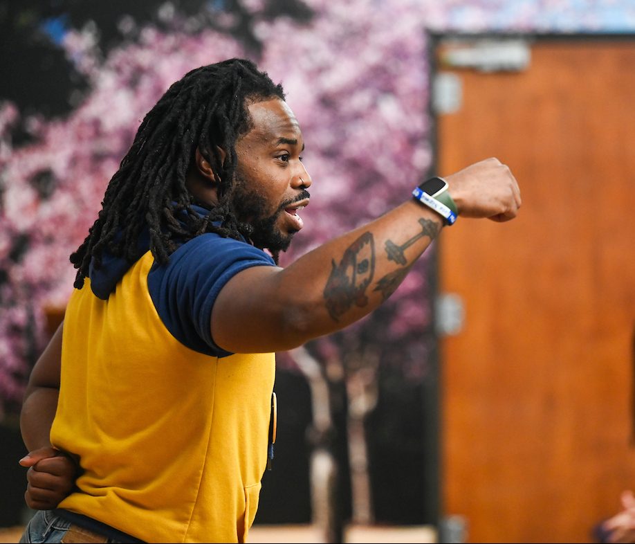 Staff, faculty and students gather Friday, Aug. 9, 2024 in the University Center to watch student Olivia Reeves compete for gold in the Olympics snatch and clean and jerk weightlifting event.