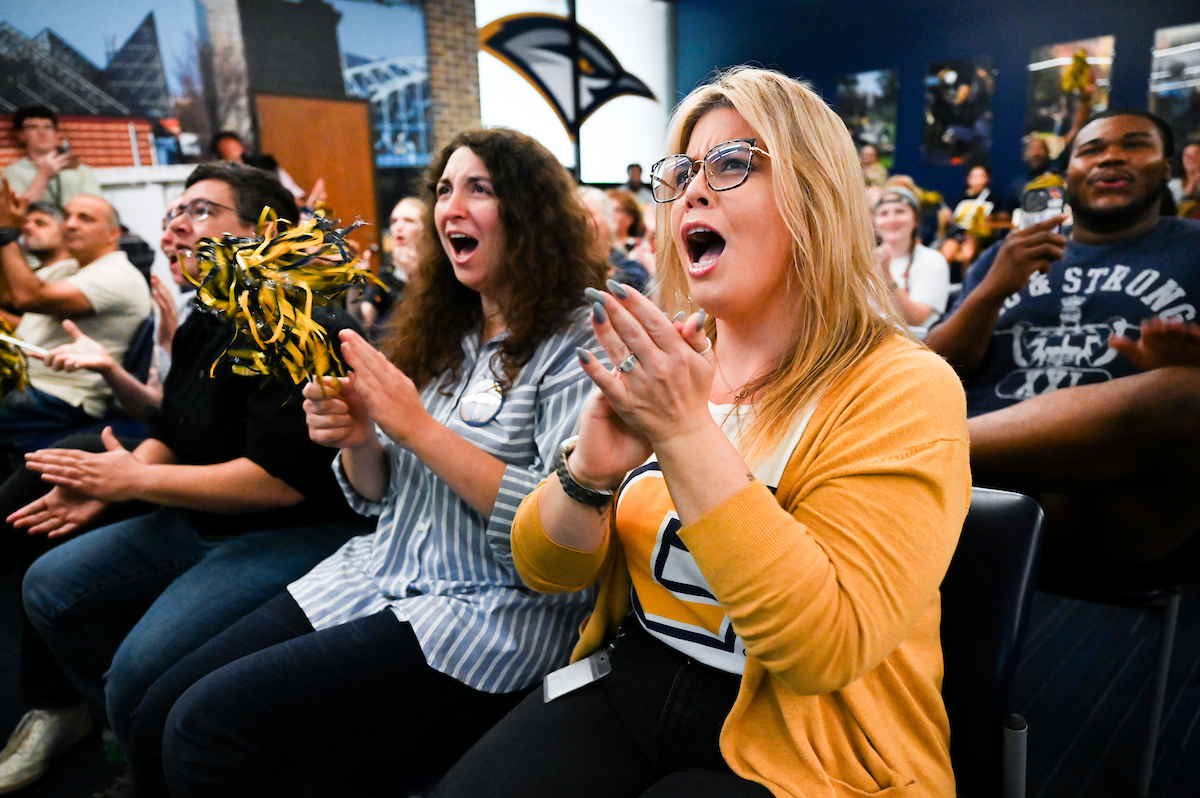 Staff, faculty and students gather Friday, Aug. 9, 2024 in the University Center to watch student Olivia Reeves compete for gold in the Olympics snatch and clean and jerk weightlifting event.