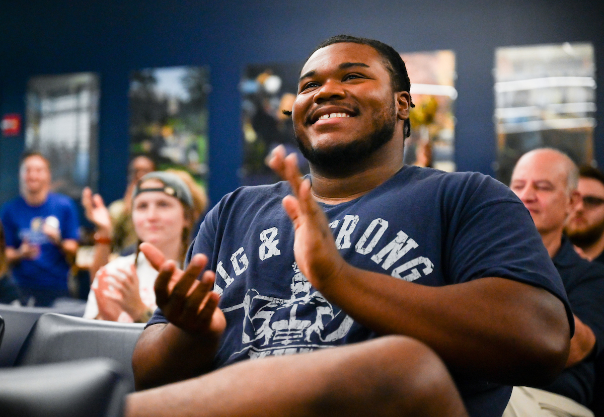 Staff, faculty and students gather Friday, Aug. 9, 2024 in the University Center to watch student Olivia Reeves compete for gold in the Olympics snatch and clean and jerk weightlifting event.
