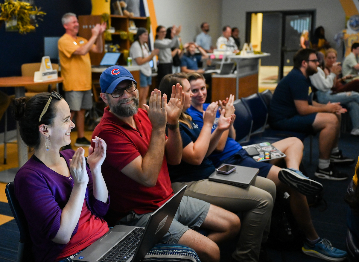 Staff, faculty and students gather Friday, Aug. 9, 2024 in the University Center to watch student Olivia Reeves compete for gold in the Olympics snatch and clean and jerk weightlifting event.