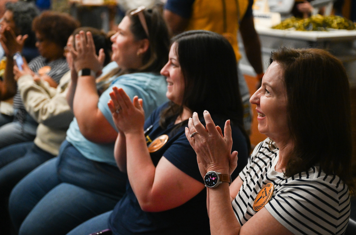 Staff, faculty and students gather Friday, Aug. 9, 2024 in the University Center to watch student Olivia Reeves compete for gold in the Olympics snatch and clean and jerk weightlifting event.