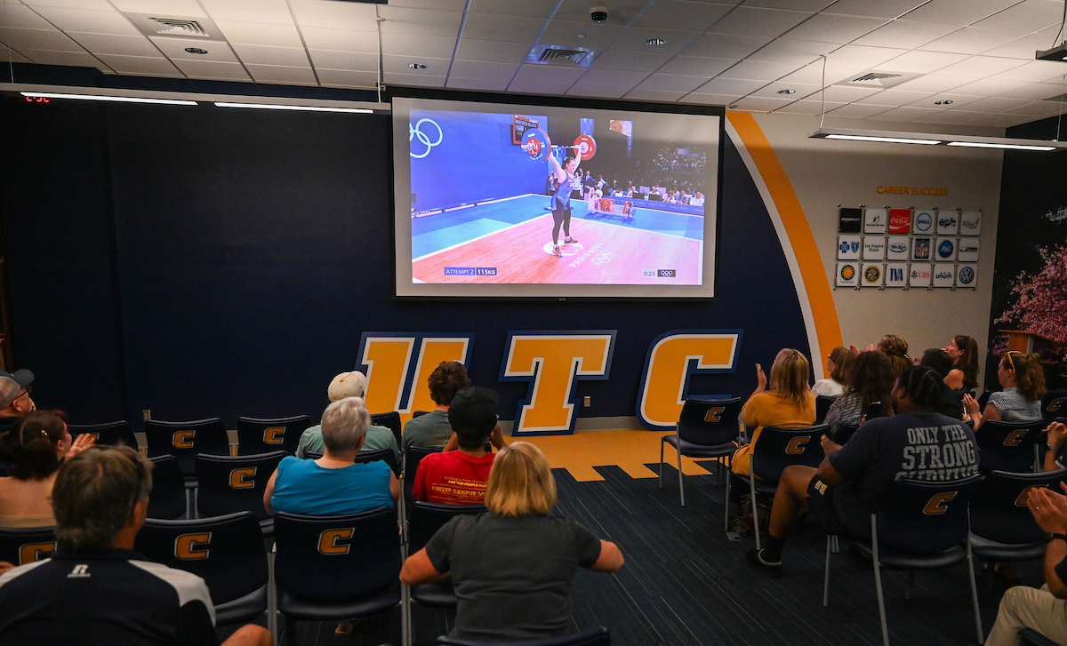Staff, faculty and students gather Friday, Aug. 9, 2024 in the University Center to watch student Olivia Reeves compete for gold in the Olympics snatch and clean and jerk weightlifting event.