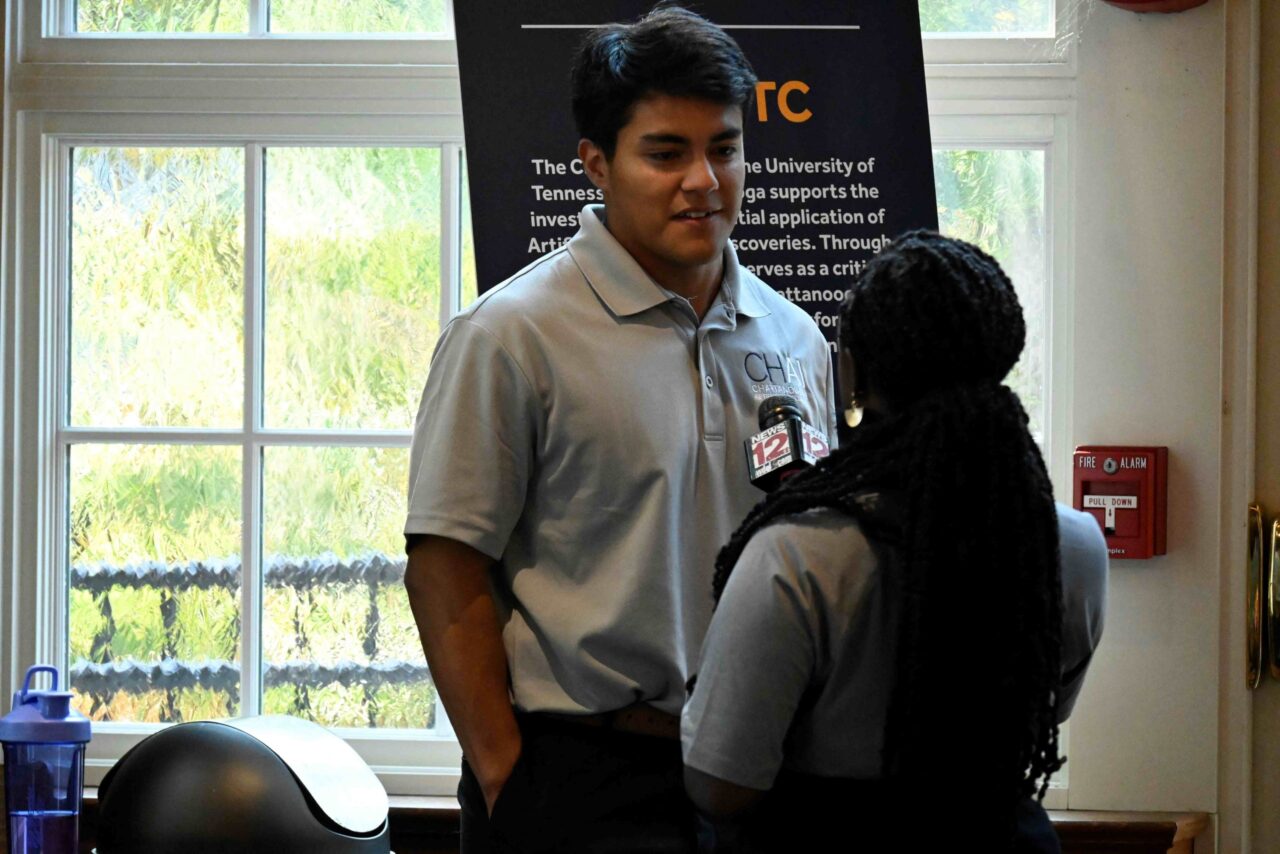 CH-AI Brews podcast host Daniel Duggin, a graduate student at UTC, is interviewed at the podcast's launch party on Aug. 29.