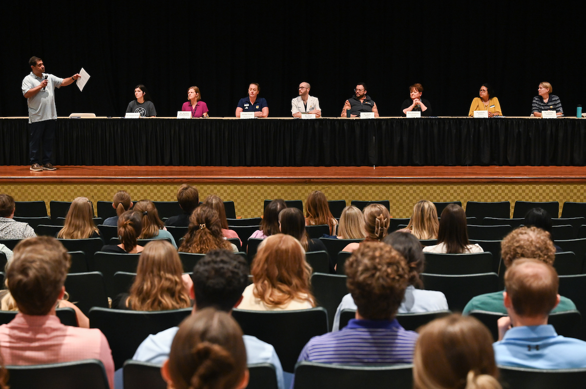 A recent interdisciplinary health care panel discussion, moderated by Physical Therapy Associate Professor Frank Tudini (left), featured Lauren Scott, Jessica Hackathorne, Jordan Yseth, Chris Doneski, Dr. Andy Glass, Mary Andrews, Rosebelle Peters and Lynette Carlson. Photo by Angela Foster.
