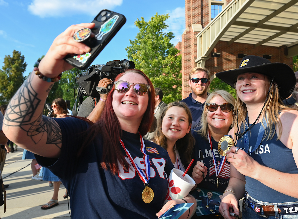 People watch a parade Tuesday, Sept. 3, 2024 to honor UTC student and Olympic Gold medalist Olivia Reeves.
