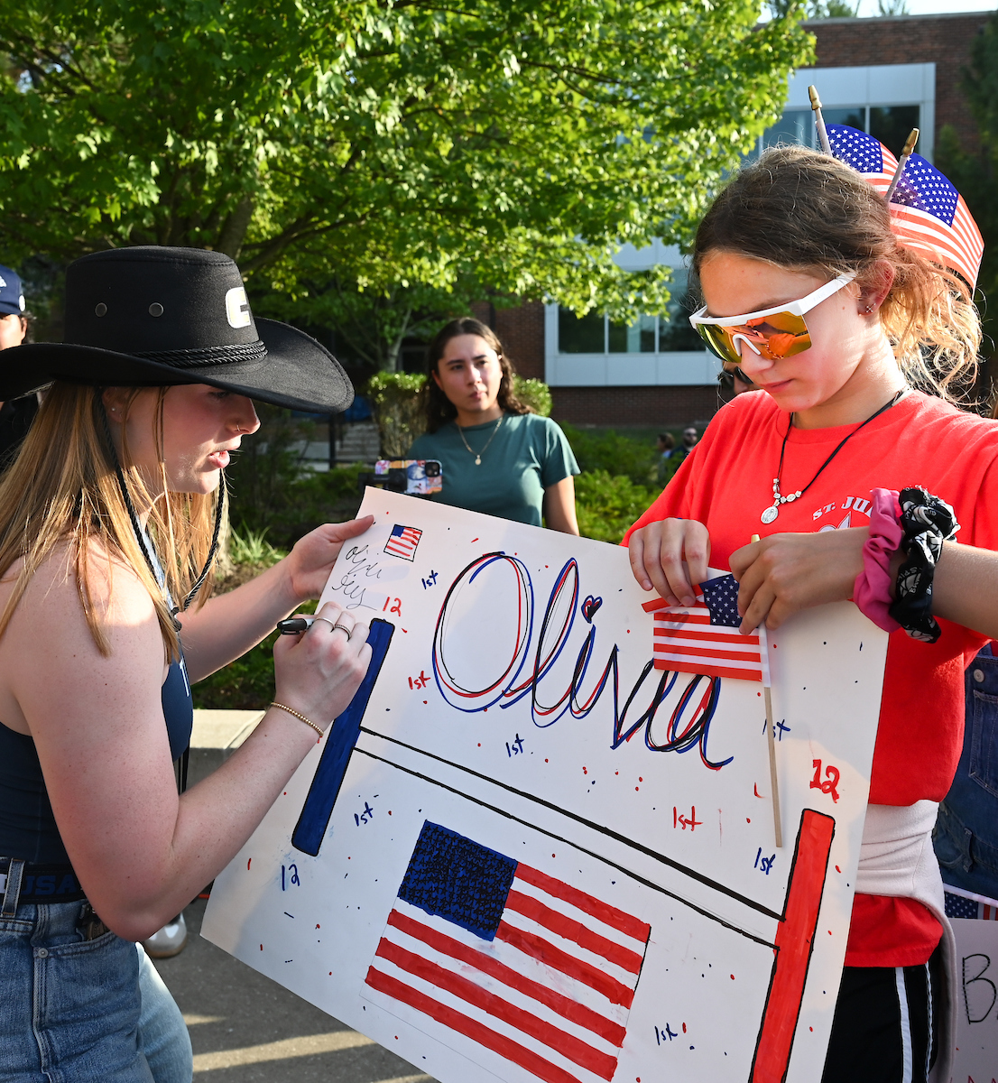 People watch a parade Tuesday, Sept. 3, 2024 to honor UTC student and Olympic Gold medalist Olivia Reeves.