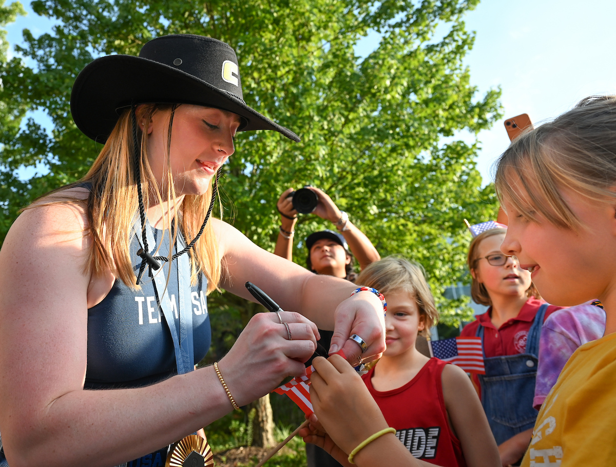 People watch a parade Tuesday, Sept. 3, 2024 to honor UTC student and Olympic Gold medalist Olivia Reeves.