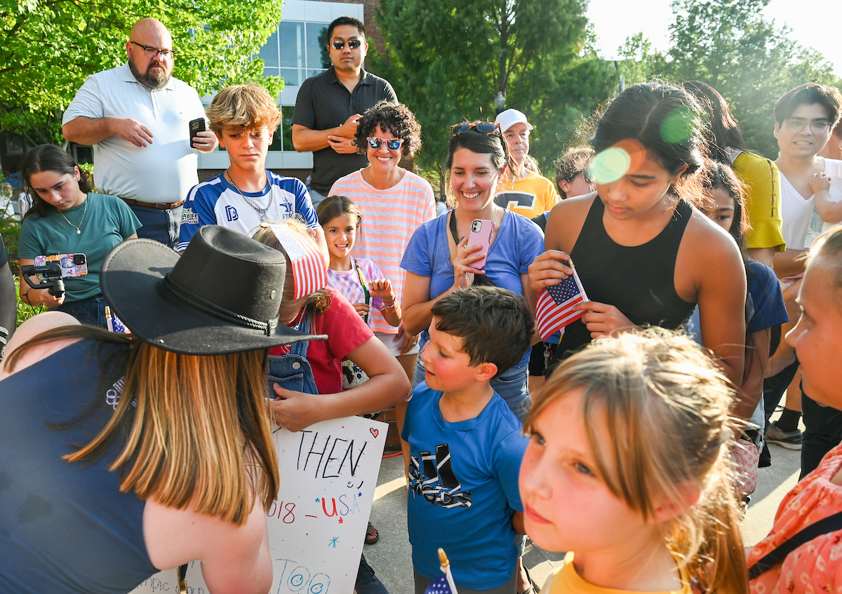 People watch a parade Tuesday, Sept. 3, 2024 to honor UTC student and Olympic Gold medalist Olivia Reeves.