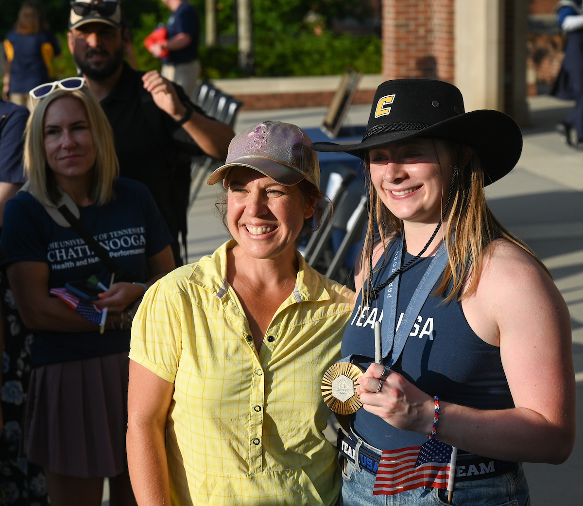 People watch a parade Tuesday, Sept. 3, 2024 to honor UTC student and Olympic Gold medalist Olivia Reeves.