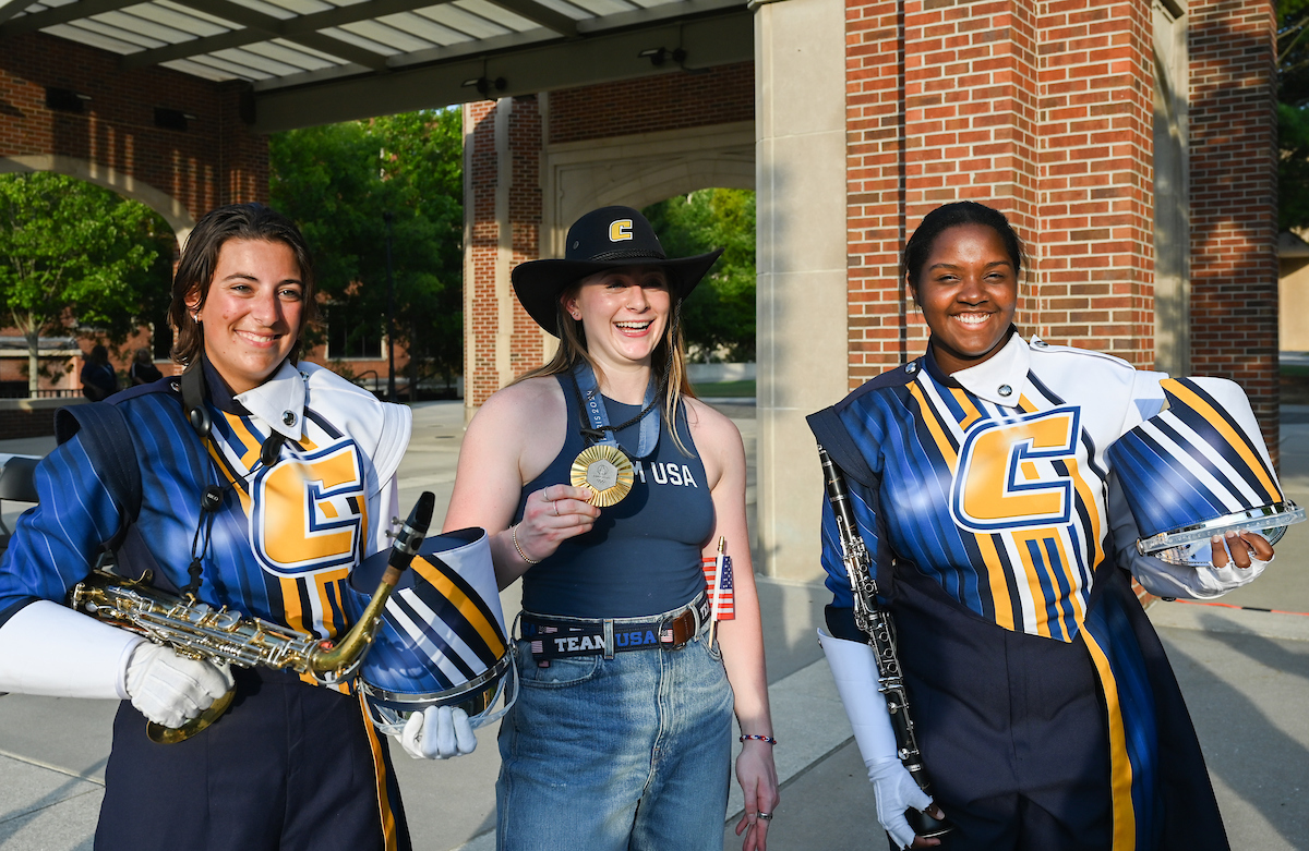 People watch a parade Tuesday, Sept. 3, 2024 to honor UTC student and Olympic Gold medalist Olivia Reeves.