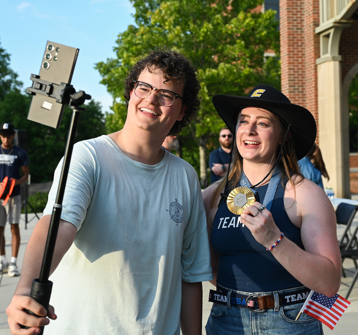 People watch a parade Tuesday, Sept. 3, 2024 to honor UTC student and Olympic Gold medalist Olivia Reeves.