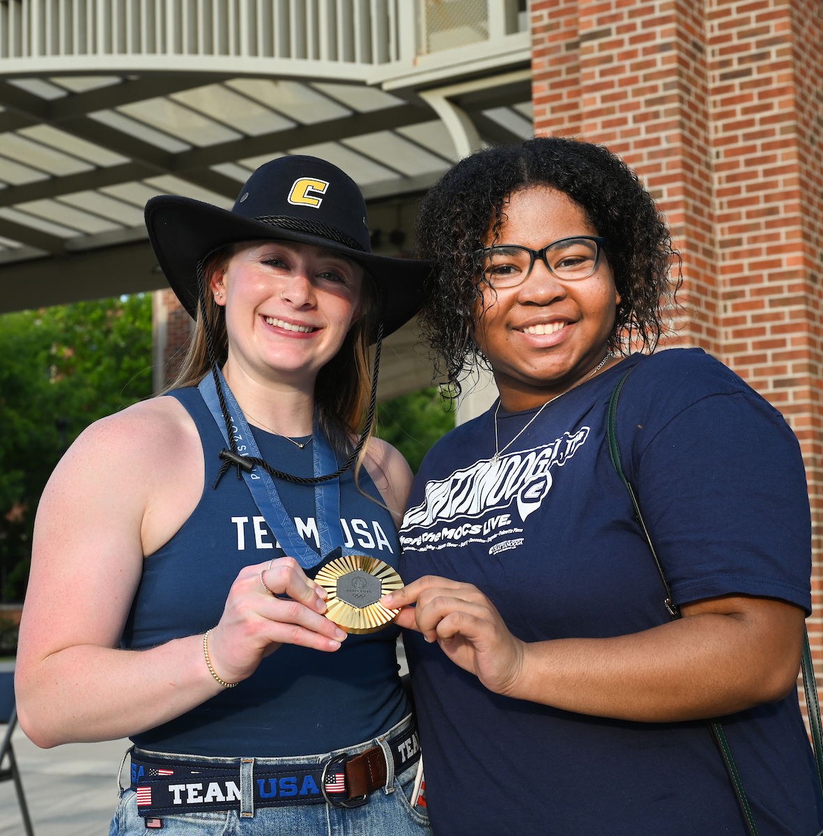 People watch a parade Tuesday, Sept. 3, 2024 to honor UTC student and Olympic Gold medalist Olivia Reeves.