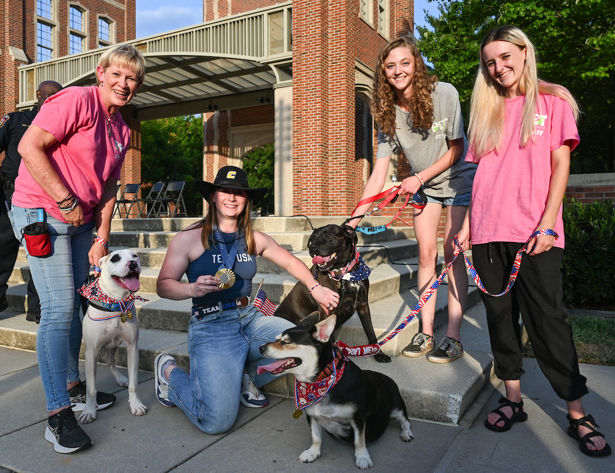 People watch a parade Tuesday, Sept. 3, 2024 to honor UTC student and Olympic Gold medalist Olivia Reeves.