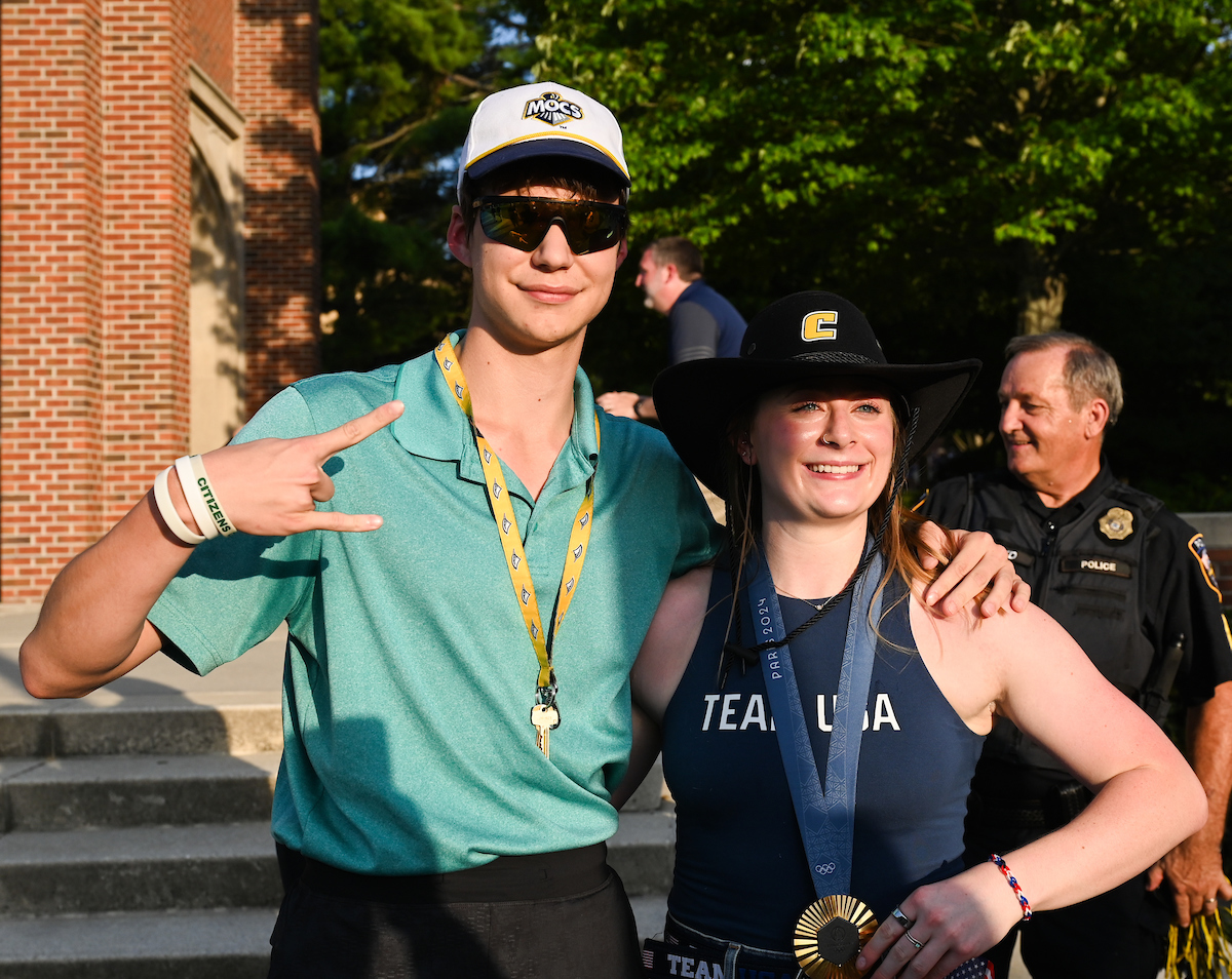 People watch a parade Tuesday, Sept. 3, 2024 to honor UTC student and Olympic Gold medalist Olivia Reeves.