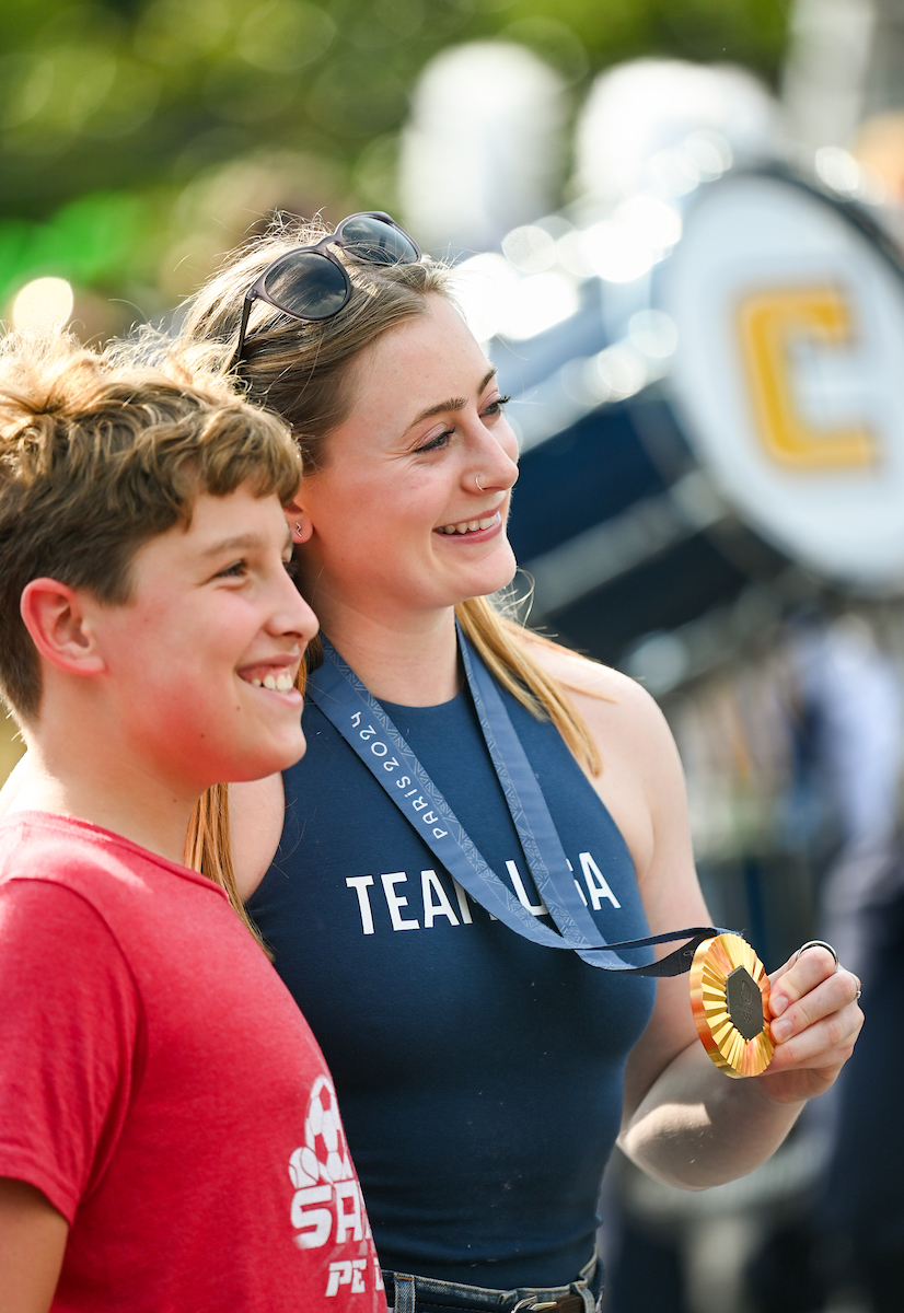 People watch a parade Tuesday, Sept. 3, 2024 to honor UTC student and Olympic Gold medalist Olivia Reeves.
