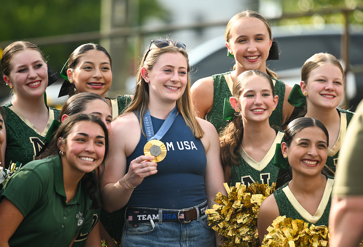 People watch a parade Tuesday, Sept. 3, 2024 to honor UTC student and Olympic Gold medalist Olivia Reeves.