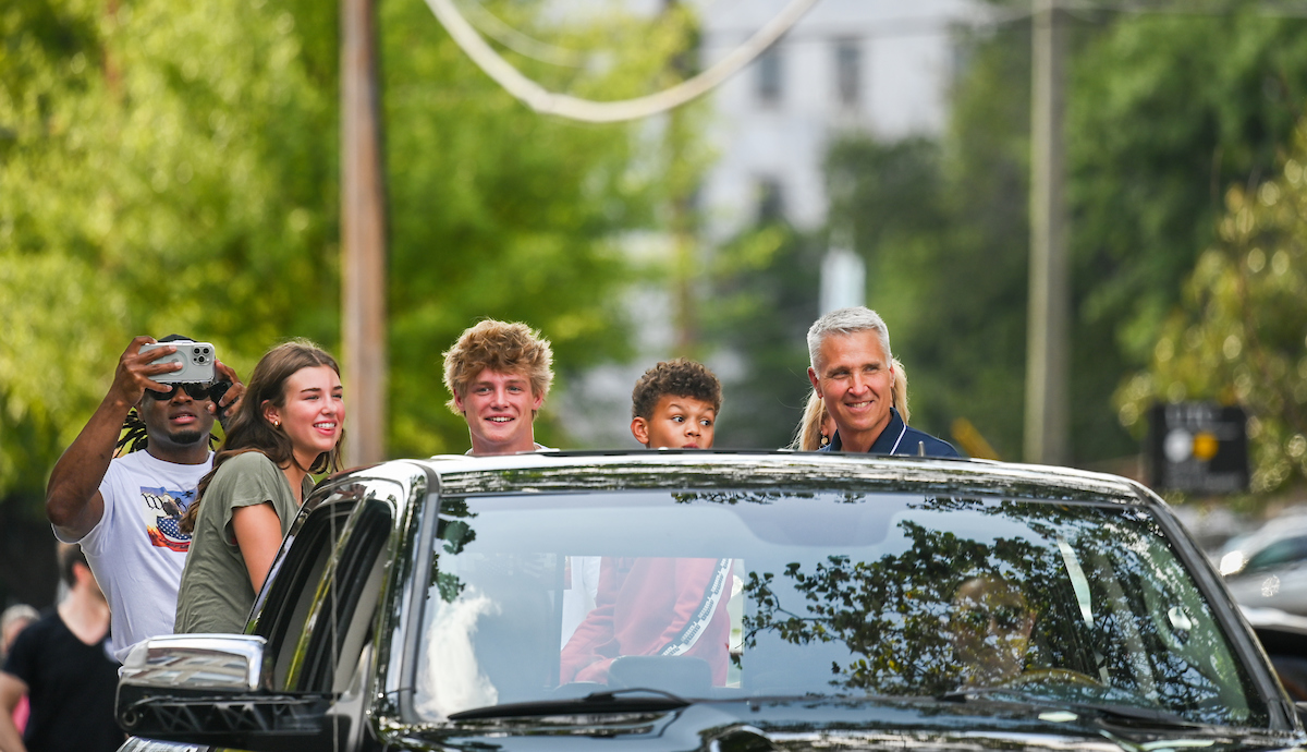 People watch a parade Tuesday, Sept. 3, 2024 to honor UTC student and Olympic Gold medalist Olivia Reeves.