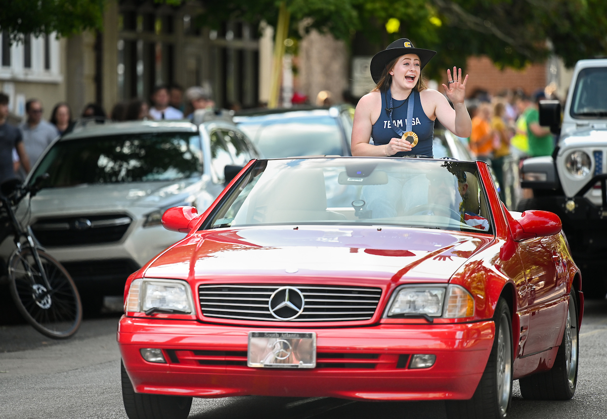 People watch a parade Tuesday, Sept. 3, 2024 to honor UTC student and Olympic Gold medalist Olivia Reeves.