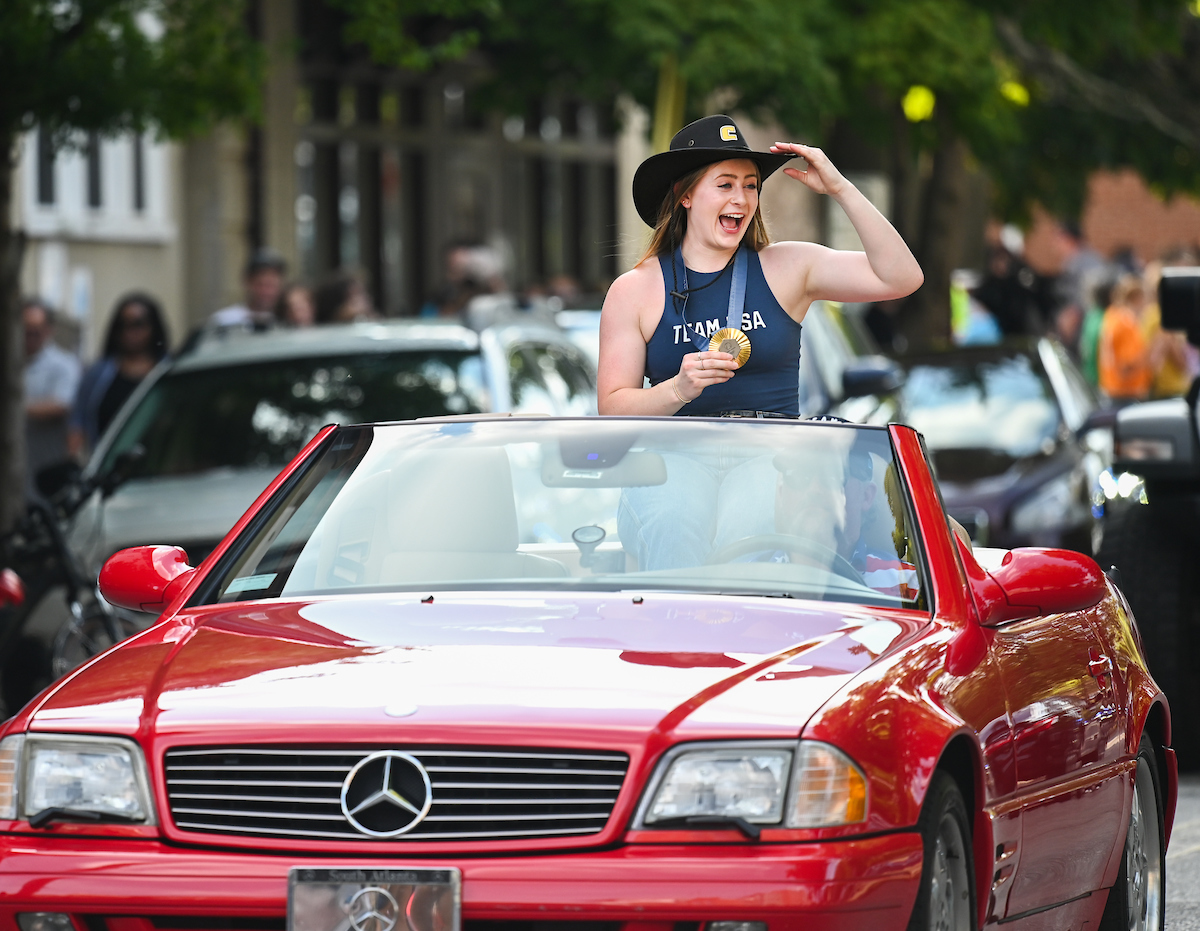 People watch a parade Tuesday, Sept. 3, 2024 to honor UTC student and Olympic Gold medalist Olivia Reeves.