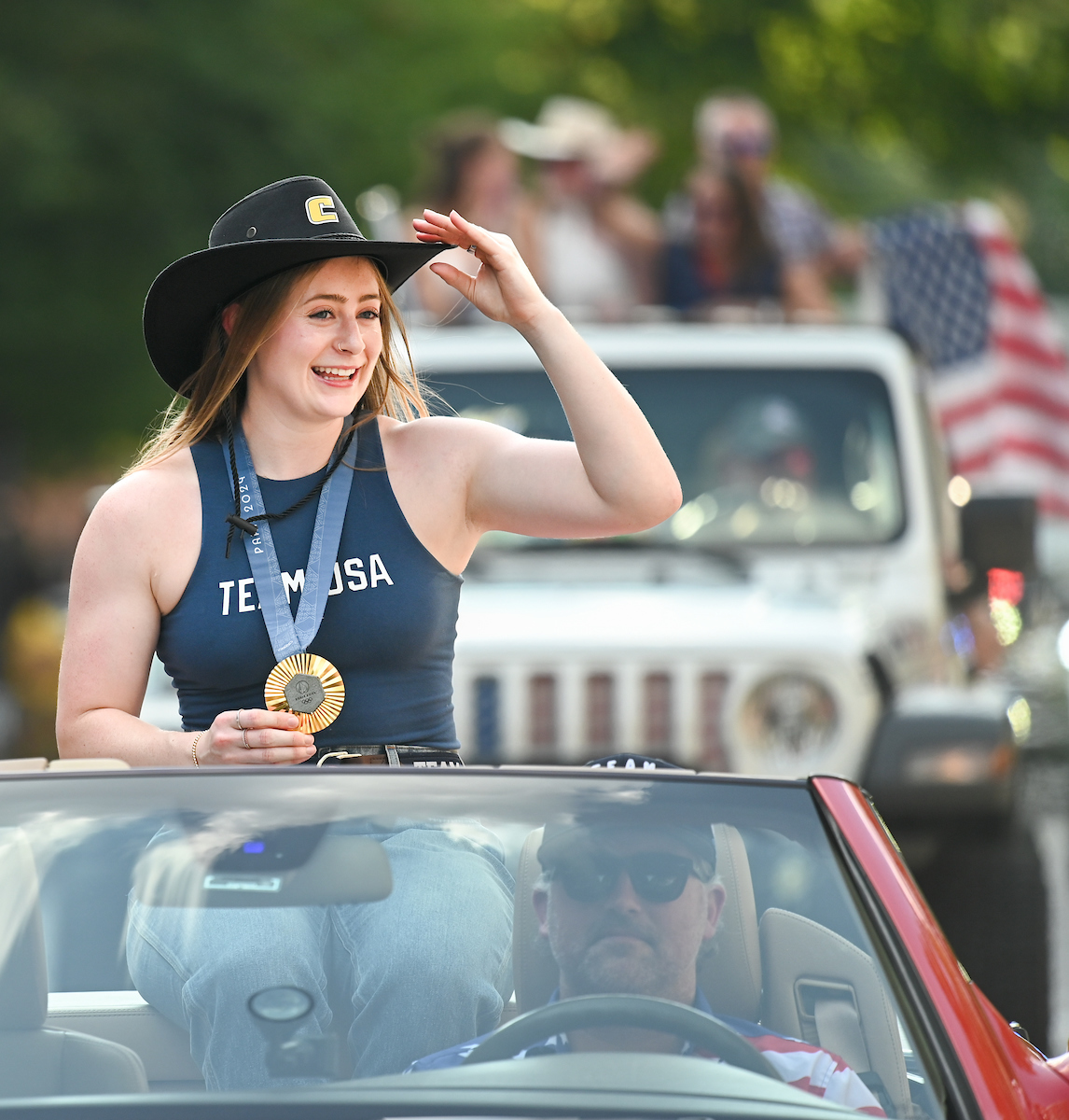 People watch a parade Tuesday, Sept. 3, 2024 to honor UTC student and Olympic Gold medalist Olivia Reeves.