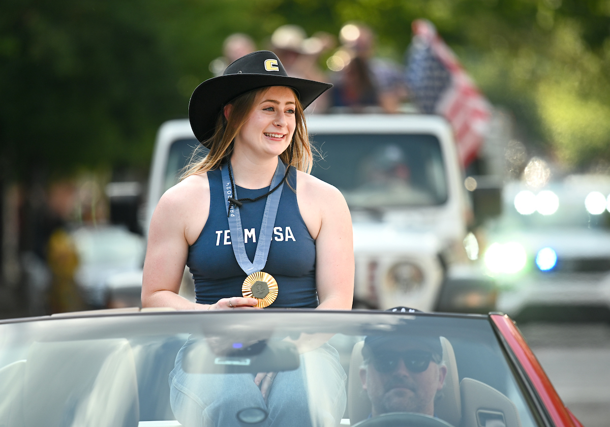People watch a parade Tuesday, Sept. 3, 2024 to honor UTC student and Olympic Gold medalist Olivia Reeves.