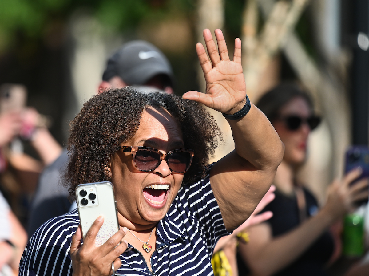 People watch a parade Tuesday, Sept. 3, 2024 to honor UTC student and Olympic Gold medalist Olivia Reeves.