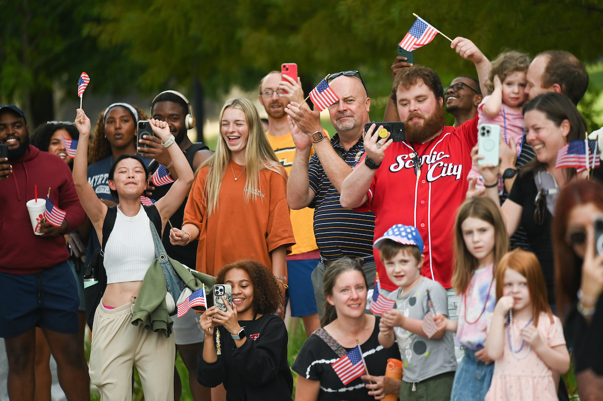 People watch a parade Tuesday, Sept. 3, 2024 to honor UTC student and Olympic Gold medalist Olivia Reeves.