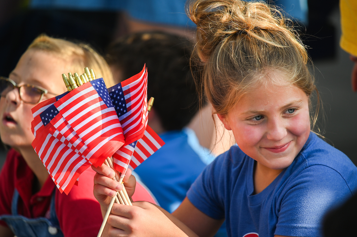People watch a parade Tuesday, Sept. 3, 2024 to honor UTC student and Olympic Gold medalist Olivia Reeves.