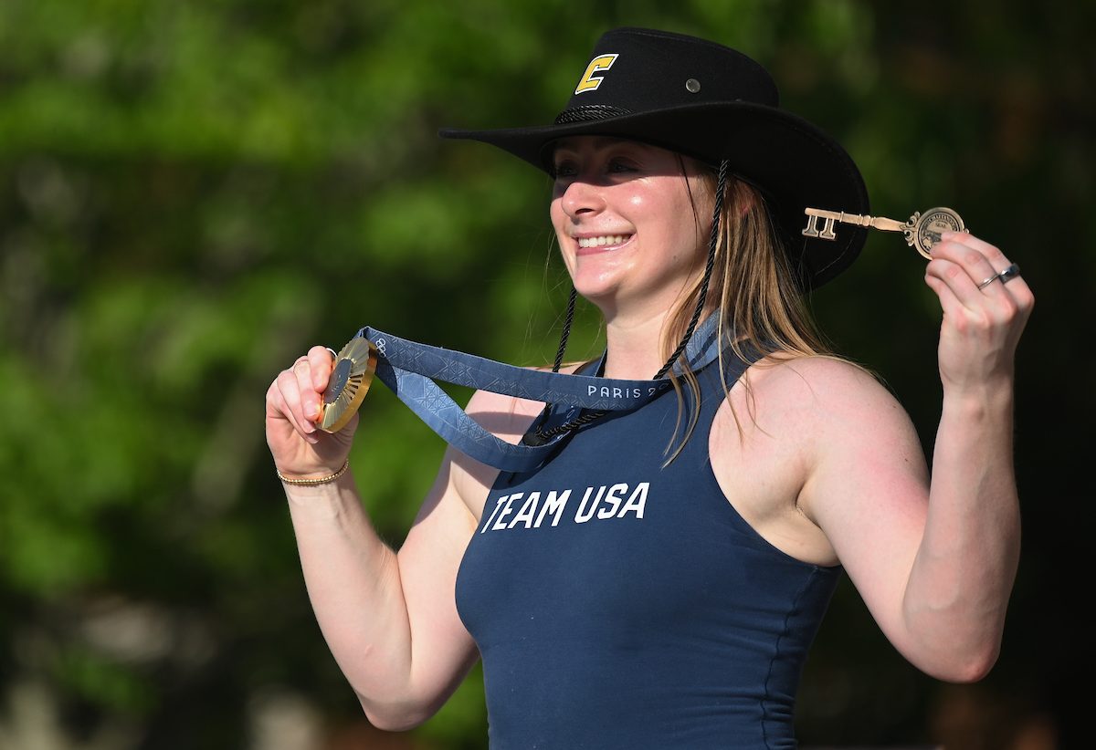 Olivia Reeves poses with her key to the city and Olympic gold medal.