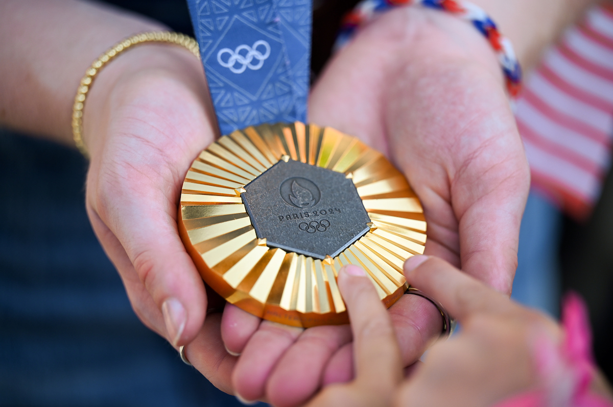 People watch a parade Tuesday, Sept. 3, 2024 to honor UTC student and Olympic Gold medalist Olivia Reeves.