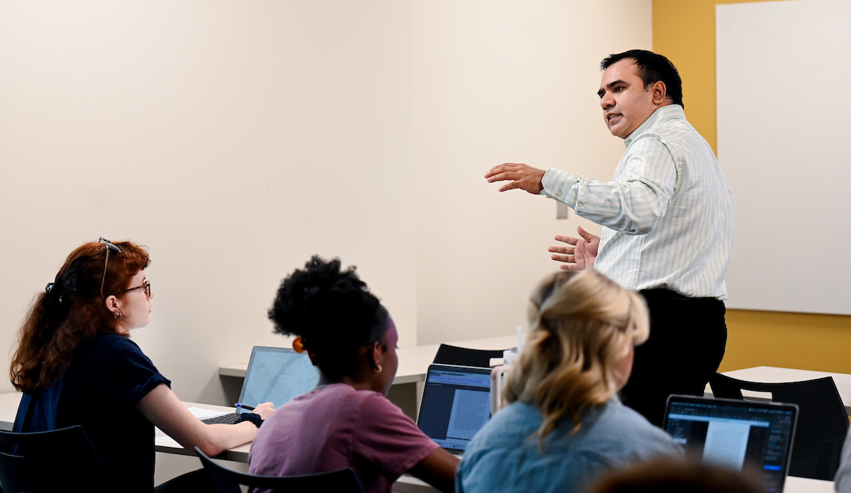 Dr. Hassan Afzal speaks in his "Public Policy in the Age of Big Data: Theory and Practice class" on Tuesday, Sept. 3, in Hunter Hall.