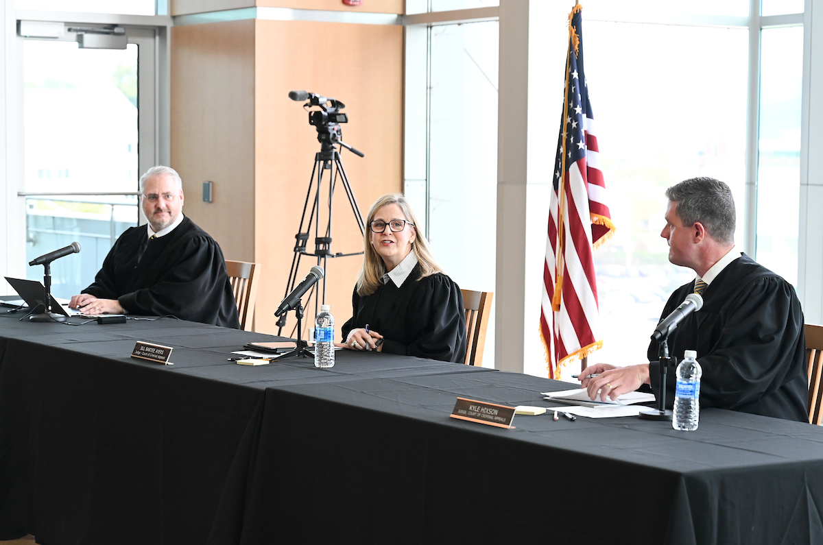 From left, Judges Tom Greenholtz, Jill Bartee Ayers and Kyle A. Hixson of the Tennessee Court of Criminal Appeals preside over cases in the UTC Library Roth Grand Reading Room on Oct. 23, 2024. Photo by Angela Foster.