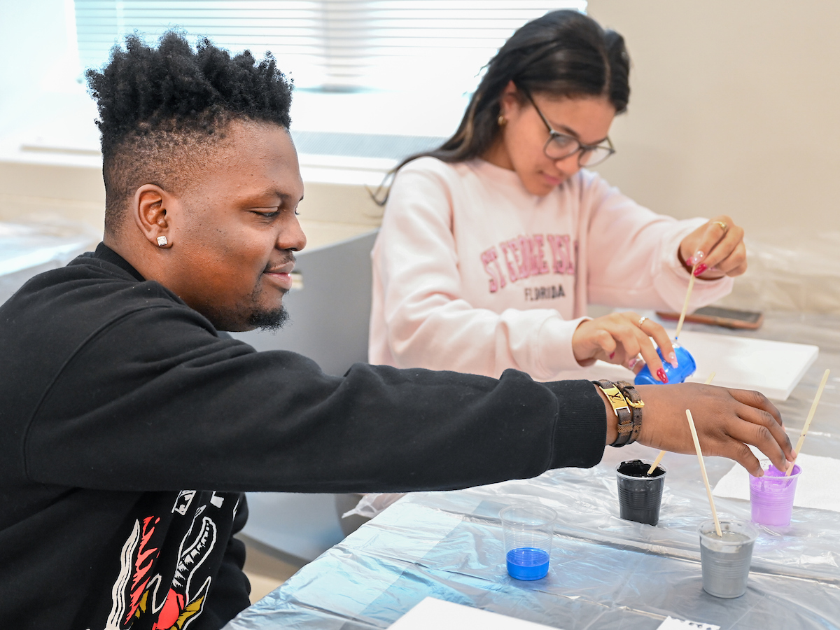 Students in Katelyn Hancock’s Ethics in Criminal Justice class participates in a paint pouring project Tuesday, Nov. 5, 2024 in 541 McCalllie.