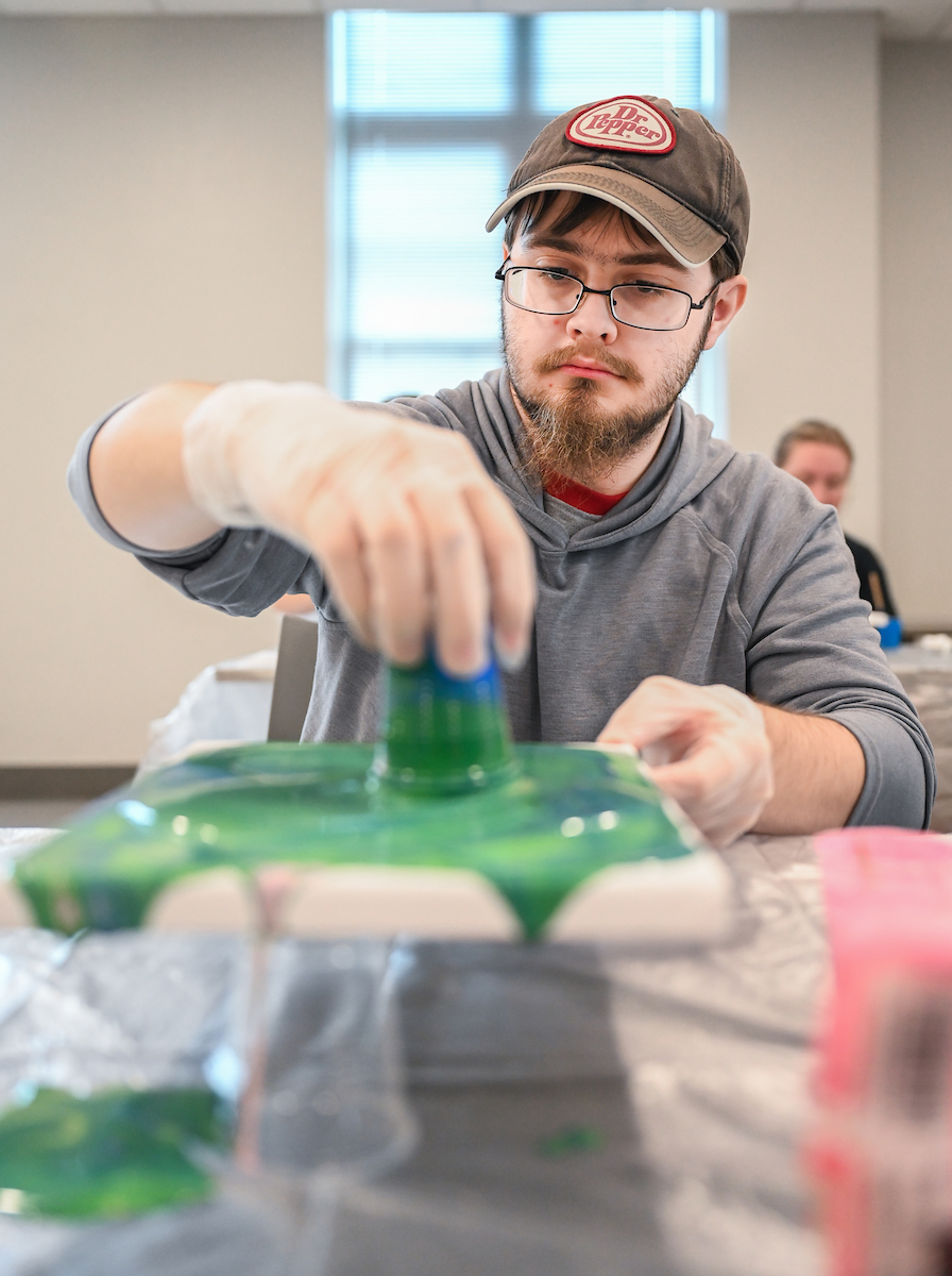 Students in Katelyn Hancock’s Ethics in Criminal Justice class participates in a paint pouring project Tuesday, Nov. 5, 2024 in 541 McCalllie.