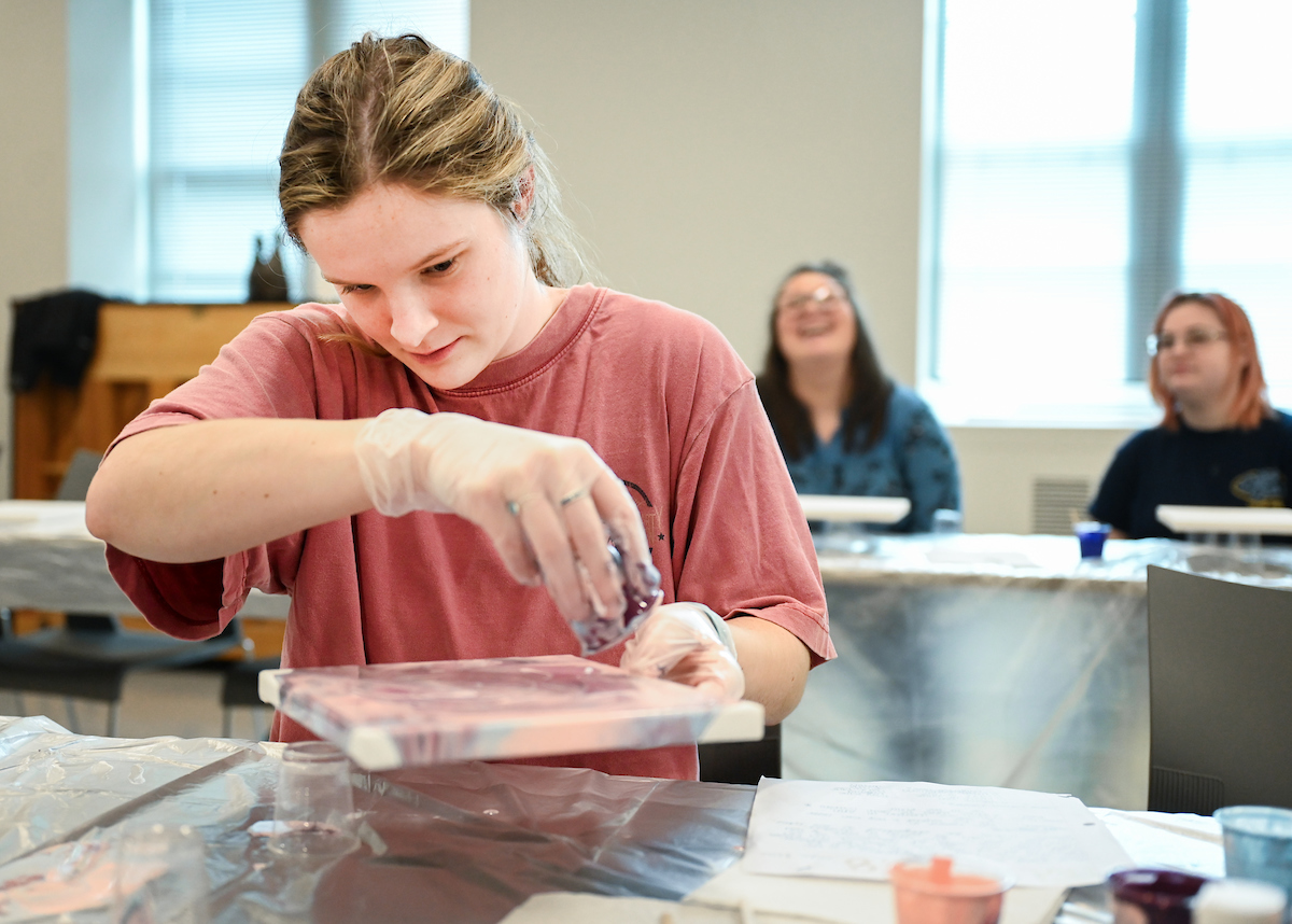 Students in Katelyn Hancock’s Ethics in Criminal Justice class participates in a paint pouring project Tuesday, Nov. 5, 2024 in 541 McCalllie.