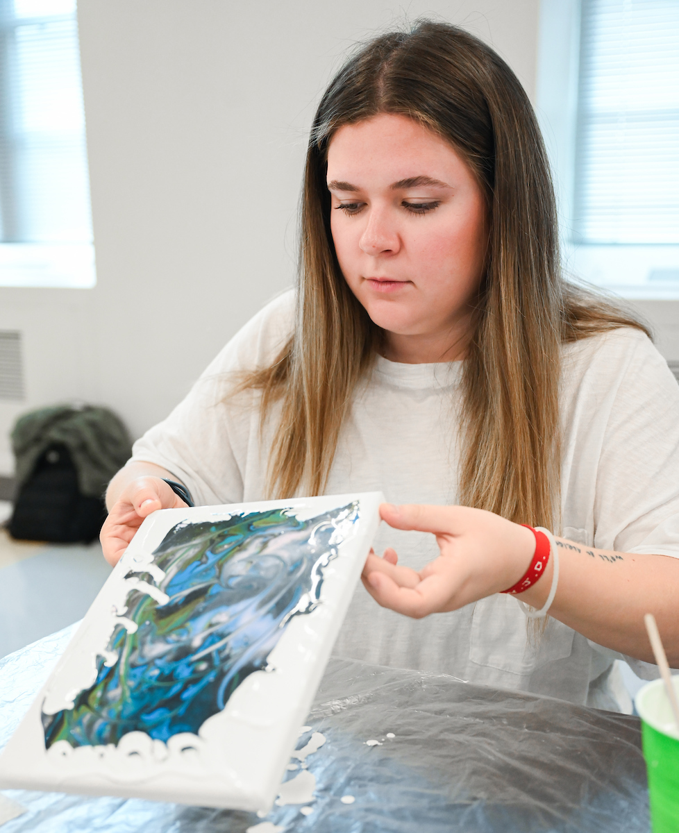 Students in Katelyn Hancock’s Ethics in Criminal Justice class participates in a paint pouring project Tuesday, Nov. 5, 2024 in 541 McCalllie.