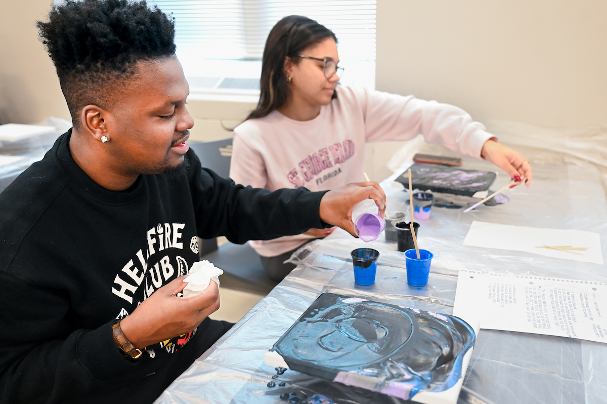 Students in Katelyn Hancock’s Ethics in Criminal Justice class participates in a paint pouring project Tuesday, Nov. 5, 2024 in 541 McCalllie.