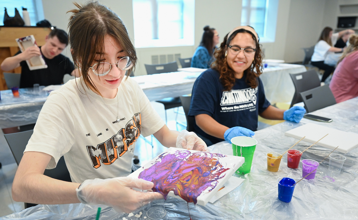 Students in Katelyn Hancock’s Ethics in Criminal Justice class participates in a paint pouring project Tuesday, Nov. 5, 2024 in 541 McCalllie.