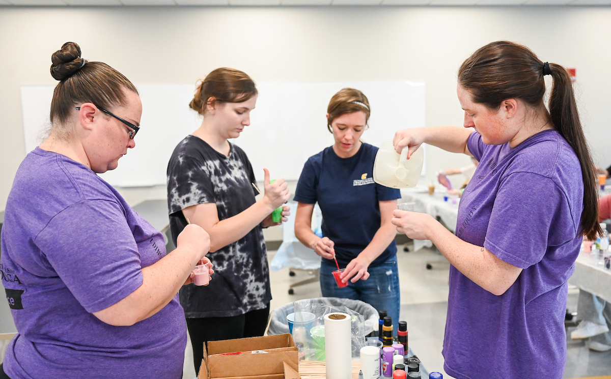 Students in Katelyn Hancock’s Ethics in Criminal Justice class participates in a paint pouring project Tuesday, Nov. 5, 2024 in 541 McCalllie.