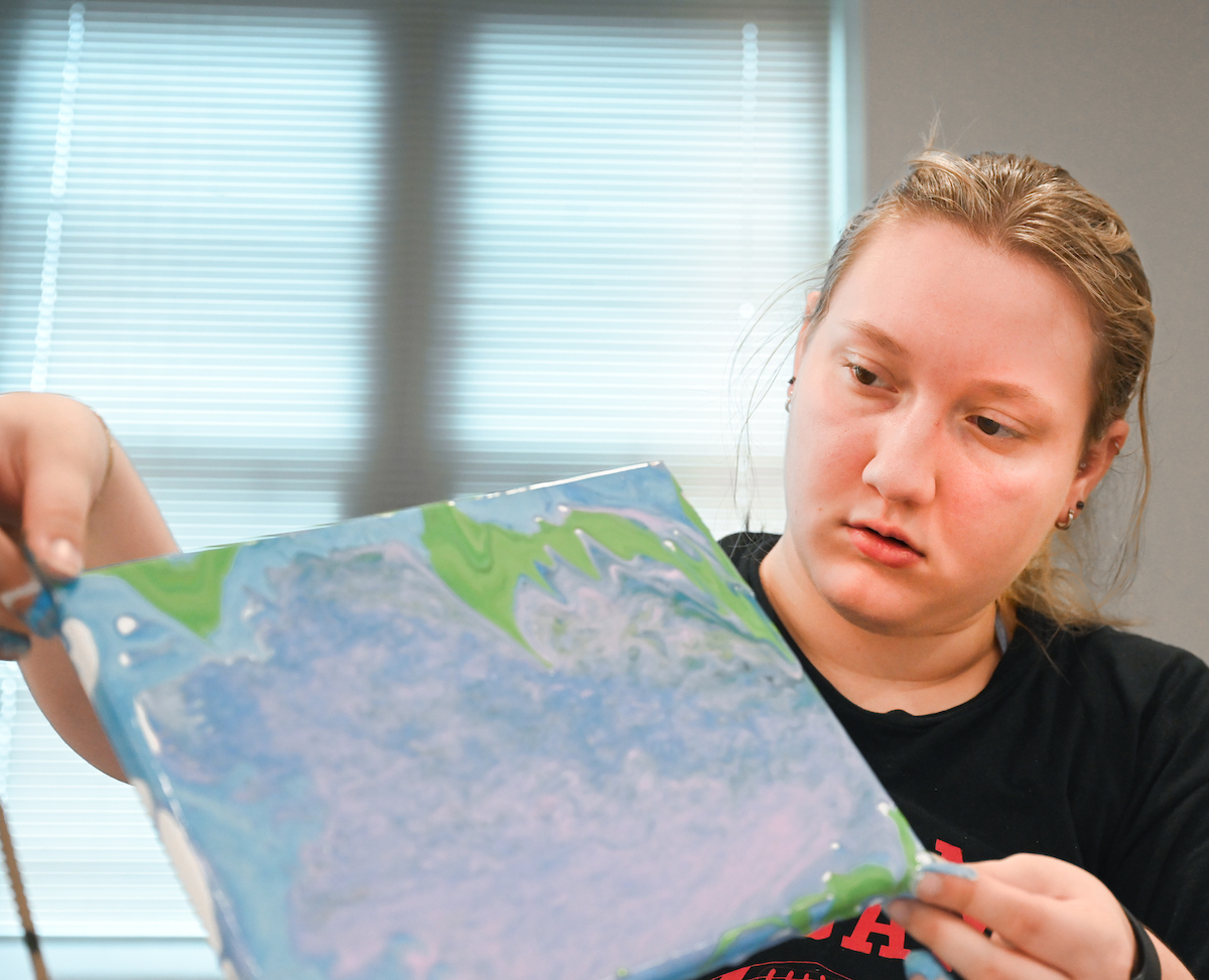 Students in Katelyn Hancock’s Ethics in Criminal Justice class participates in a paint pouring project Tuesday, Nov. 5, 2024 in 541 McCalllie.
