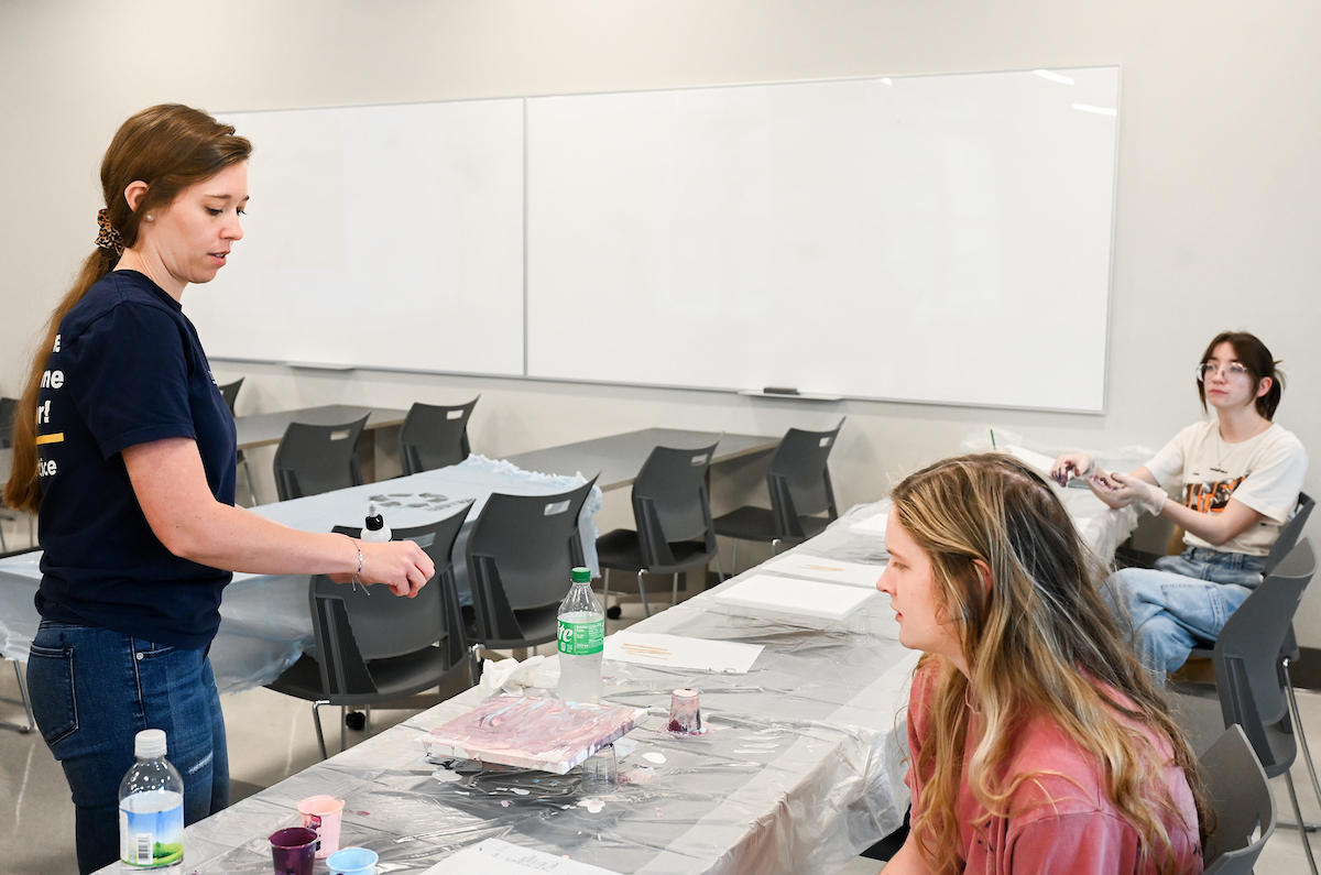 Students in Katelyn Hancock’s Ethics in Criminal Justice class participates in a paint pouring project Tuesday, Nov. 5, 2024 in 541 McCalllie.