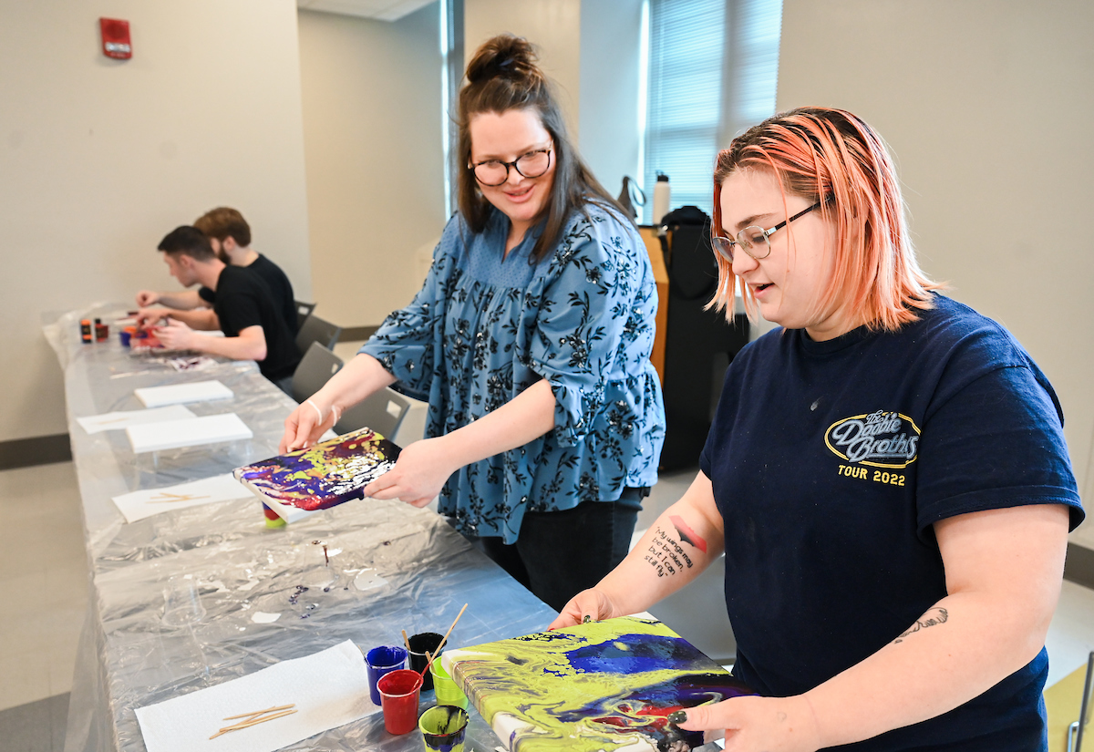 Students in Katelyn Hancock’s Ethics in Criminal Justice class participates in a paint pouring project Tuesday, Nov. 5, 2024 in 541 McCalllie.