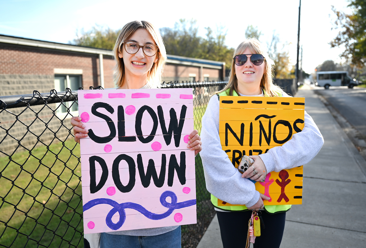 Students in Chandra Ward’s Innovation in Honors class work Monday, Nov. 18, 2024 to put up tactical urbanism traffic calming installations in the Oak Grove neighborhood.