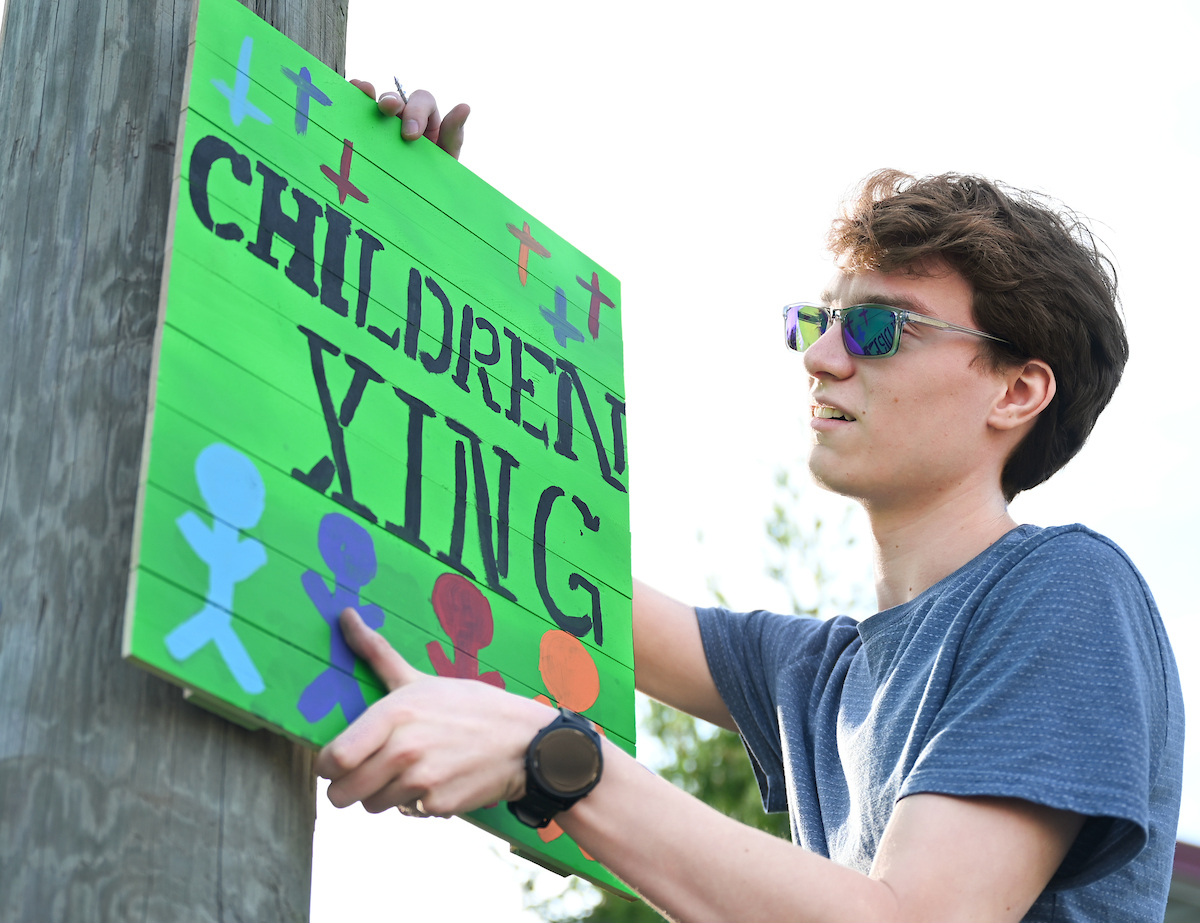 Students in Chandra Ward’s Innovation in Honors class work Monday, Nov. 18, 2024 to put up tactical urbanism traffic calming installations in the Oak Grove neighborhood.