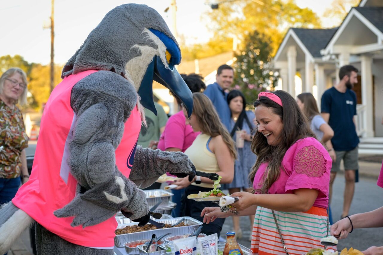 Scrappy serves MOMentum founder Cara Hicks during the MOMentum Network's10th Anniversary Celebration on Thursday, Oct. 24. Photo by Bethany Cothran.