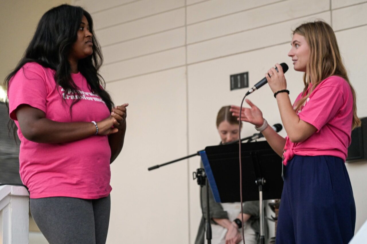 Mia Burrell asks Laniesha Gatewood about her MOMentum experience. Photo by Bethany Cothran.