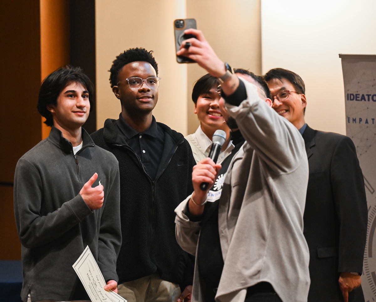STEM School Chattanooga students Neal Khera, left, Maliki Lee and Josh Bun take a selfie with Inventanooga Program Director Kyle Carrasco and Dr. Subin Im after their team won the Inventanooga 2024 executive pitch competition. Photo by Angela Foster.