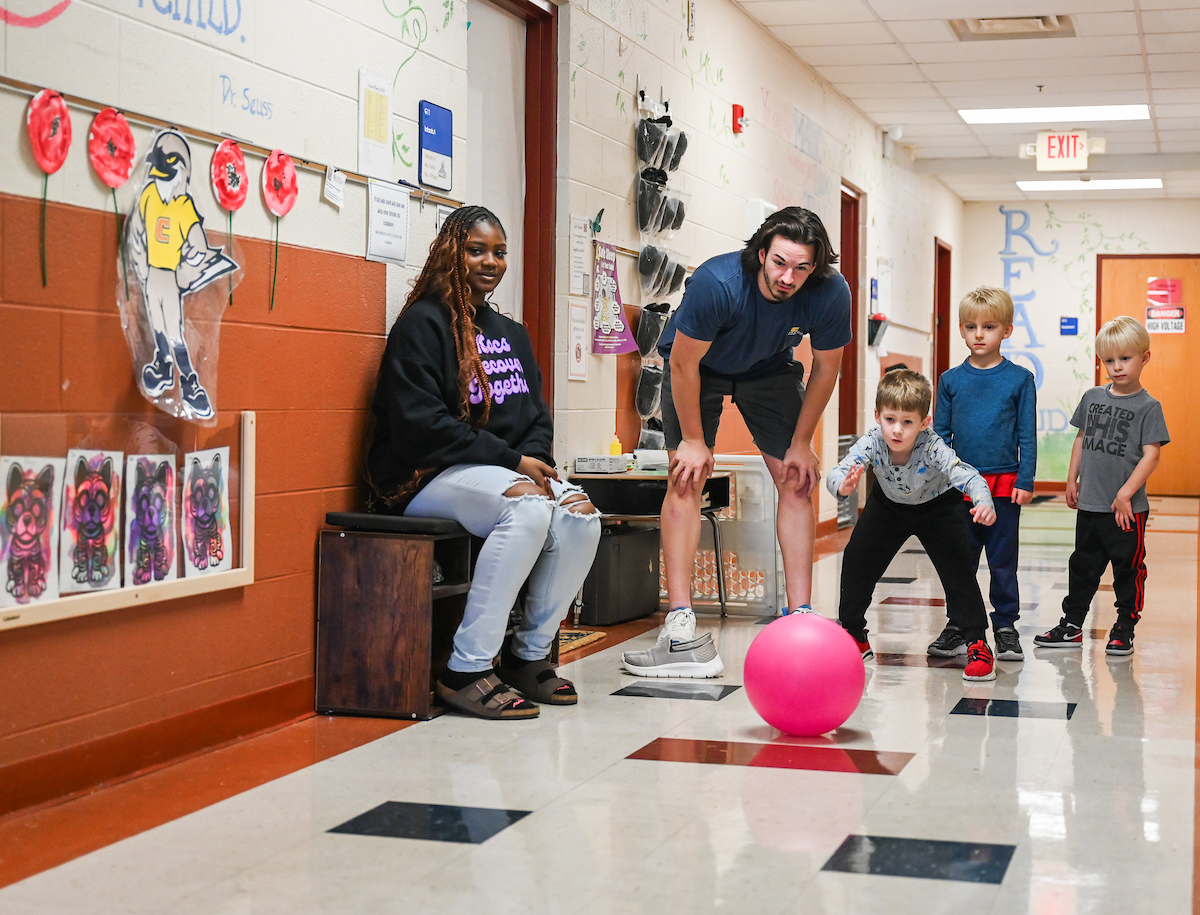 Jamie Harvey’s Physical Education in the Elementary School students work with children Wednesday, Nov. 13, 2024 at the UTC Children’s Center.