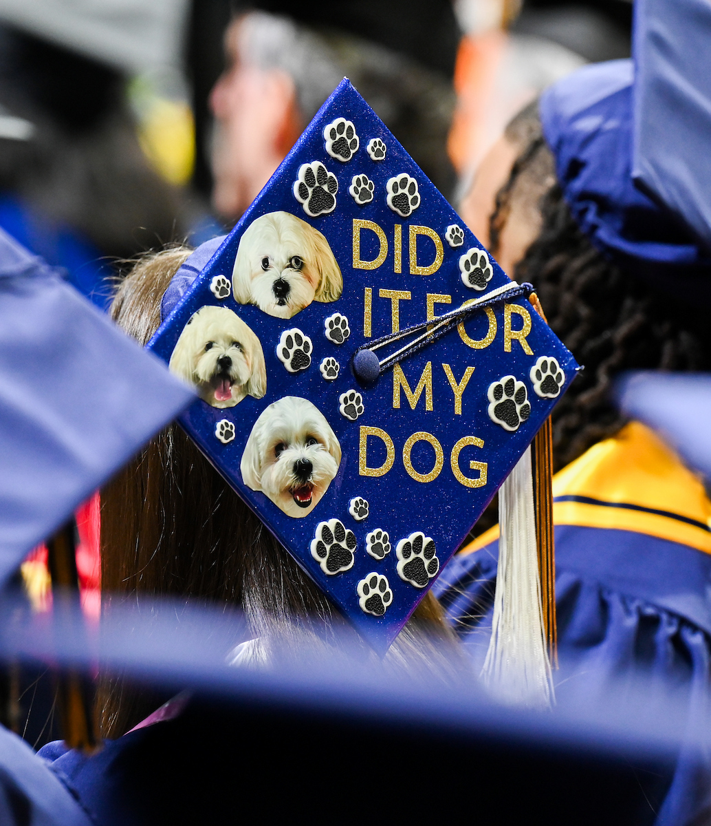 A University of Tennessee at Chattanooga student wears a decorated cap Saturday, Dec. 14, 2024 during the undergraduate graduation ceremony in McKenzie Arena