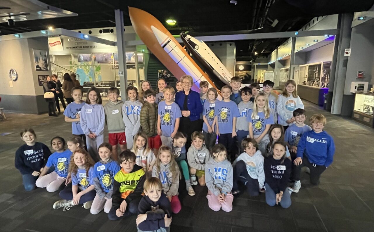 Dr. June Scobee Rodgers poses with third-grade students at the UTC Challenger STEM Learning Center. Photo courtesy of Lisa Vernal.